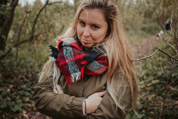 Girl in autumn forest nature with brown colors