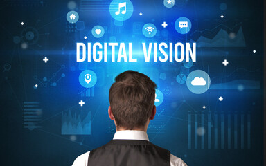 Rear view of a businessman with DIGITAL VISION inscription, modern technology concept