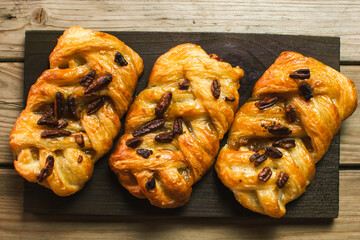 Danish pastry maple pecan with nuts and maple syrup