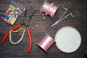 Making jewelry, home workshop background.
