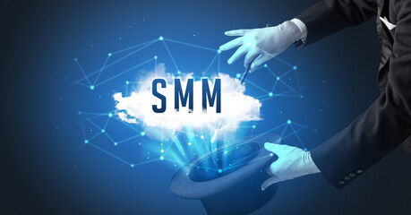 Magician is showing magic trick with SMM abbreviation, modern tech concept