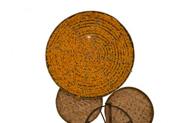 Silkworm cocoon in bamboo weave tray on white background with clipping path. Cocoons of Thai silkworm growing in bamboo trays. Silkworm is a source of silk thread and silk fabric..