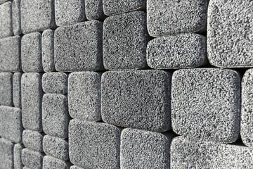 The surface is paved with road tiles of different sizes (multi format). The uneven (melange) color...