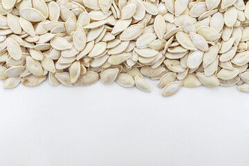 Pumpkin seeds background. Space for text.