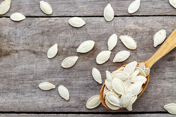 Pumpkin seeds in a wooden spoon