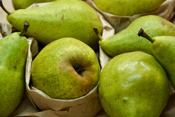 Pears background. Fresh pear fruit. Autumn fruits harvest on retro paper background. Organic farmers market products. Sweet, fresh and healthy food.