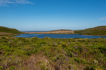 Fototapeta na wymiar Abbotts Lagoon viewed from a distance on a clear sky day