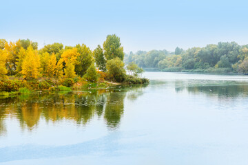 River water landscape. Forest river in autumn. Forest lake view. Autumn forest river refelction in water. Autumn nature forest river landscape. Lake water reflection in autumn.