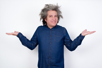 Cheerful cheery optimistic Handsome mature caucasian man with afro grey hair standing over isolated white background holding two palms copy space