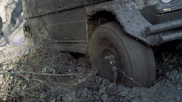 Tire mud. Offroad car on bad road, slow motion.