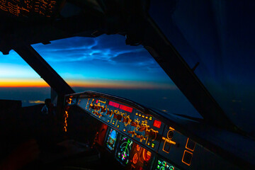 Night image of the cockpit with selective focus and blurred background of sunset.