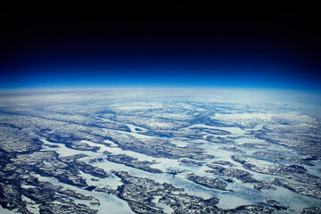 You can definitely see the curvature of the Earth flying at 40,000 Ft. - obrazy, fototapety, plakaty
