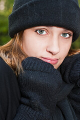 EMILY SHOEMAKER wearing winter mittens, scarf & hat .