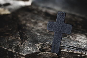 Large wooden Christian cross on an old wooden background. Religious concept