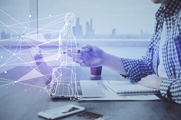 Start up drawings with businessman working on computer on background. Teamwork concept. Double exposure.