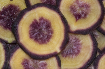 Purple carrot Daucus carota ssp sativus var atrorubens sliced of this variety of vegetable with delicious orange and purple flavor