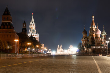 View on the Red Square. St. Basil's Cathedral and the Spasskaya Tower of the Moscow Kremlin with chimes.