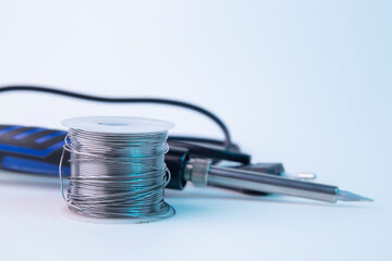 Solder for soldering with a soldering iron in a Bay on a white background.