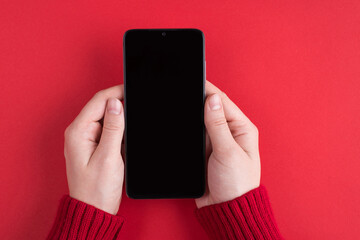 Firts person close up top above overhead close up view photo of female young hands holding using telephone showing blank screen sending greetings isolated over bright color background