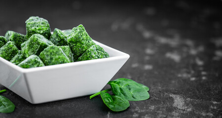 Portion of frozen spinach (close up; selective focus)