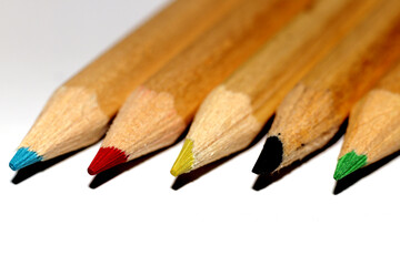 Wooden Crayons on a white background - close up