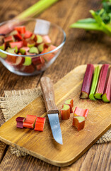 Chopped Rhubarb on an old wooden table (close up shot)