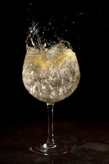splash of a refreshing gin and tonic from a cocktail bar