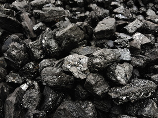 Natural black coals background texture. Top view of fuel for industrial coal