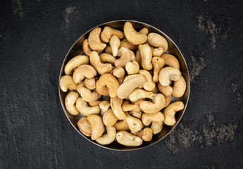 Some roasted Cashew Nuts (close up; selective focus)