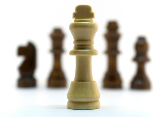 Simple wooden chess in a variety of positions. Isolated on white background