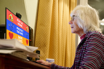 Fototapeta na wymiar Senior old lady reading new coronavirus guidelines at computer screen