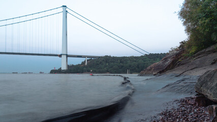 Bridge above the lake at sunset.