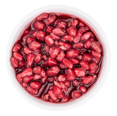 preserved Pomegranate seeds isolated on white background (selective focus; close-up shot)