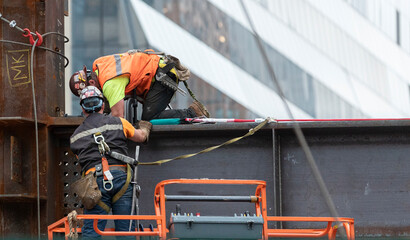 2 Steel framers at work on the erecting of a hi-rise building in Manhattan’s Hudson Yards development