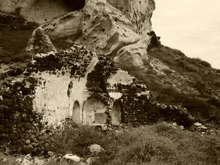 Magic Oia, Sanorini island Greece in sepia. Views of the historical part of the city of Oia. Streets and houses of the old city.