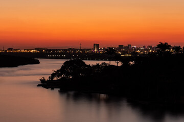 Naklejka premium Sunset in Brasilia, the capital of Brazil, seen from Lago Norte. The city of amazing skies. Cerrado. Nightview.