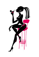 Girl sitting on a bar stool with a cocktail glass.