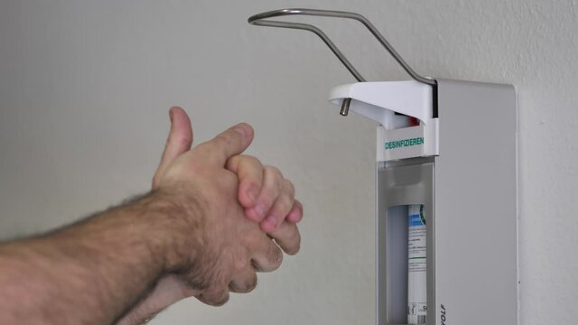 Man Sterilises His Hands With An Alcohol Based Disinfectant Gel, CoronaVirus