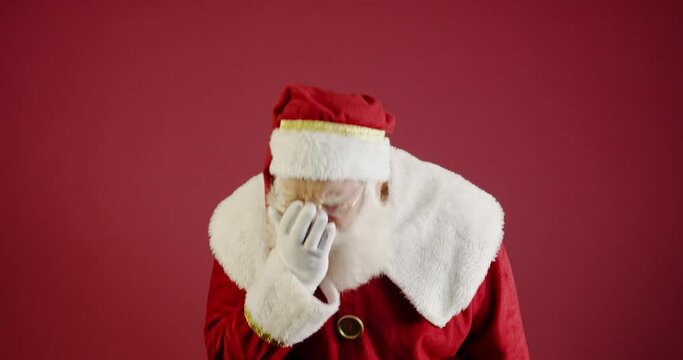 Santa Claus with Covid-19 sneezing. Christmas 2020. Pandemic. 4K.