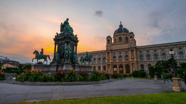 Beautiful view of famous Naturhistorisches Museum (Natural History Museum) with park and sculpture timelapse hyperlapse in Vienna, Austria. Warm light at evening