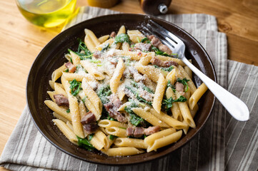 boiled penne with pancetta and arugula