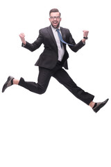 in full growth. happy dancing young businessman