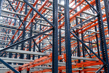 Rows of Metallic racks in modern warehouse racking Systems on logistic center