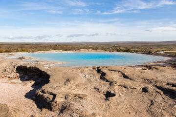 HAUKADALUR, ICELAND - SEPTEMBER 19, 2018: Haukadalur geothermal area is a famous sigth in Iceland, with geysers and other geothermal features including Strokkur, a very powerful and active geyser.