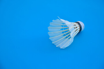 Badminton shuttlecocks feather and badminton racket, concept for badminton lovers around the world.