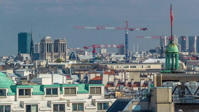 Cityscape view on the beautiful buildings with Centre of Pompidou timelapse from gallery lafayette terrace in Paris. Sunny weather at summer day. Rooftop panorama