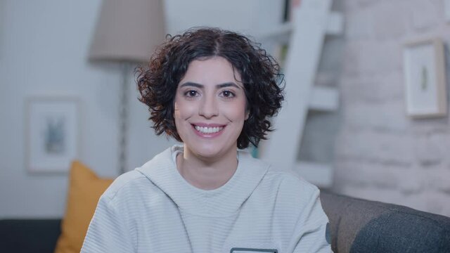 Young woman laughing at the camera.Portrait of beautiful smiling woman.
