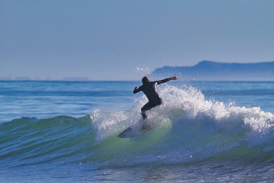 Surfing at Rincon cove in California