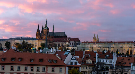 Naklejka na ściany i meble St. Vitus Cathedral and Prague Castle in the center of Prague at sunset the sky is colored by light