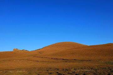 Hills under blue sky in Keshiketeng World Geopark, Inner Mongolia